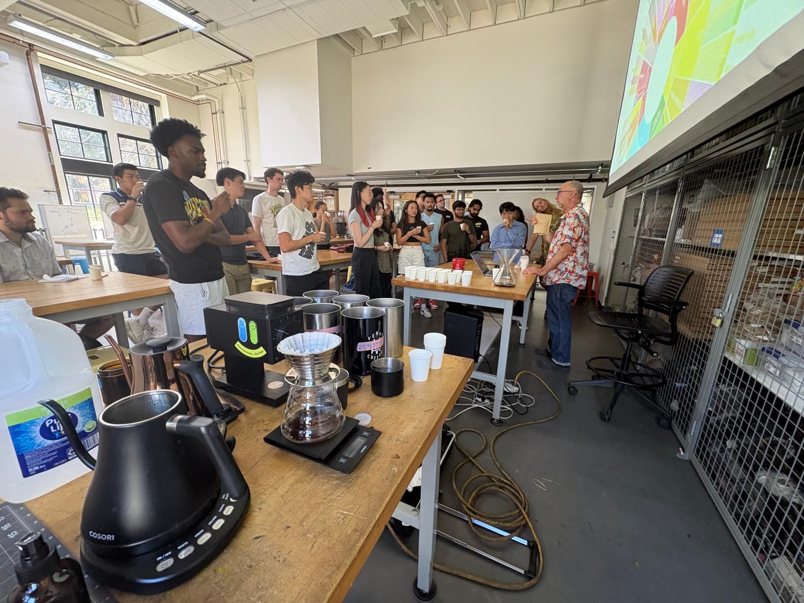 Students gathered around a coffee workshop